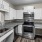 a kitchen with white cabinets