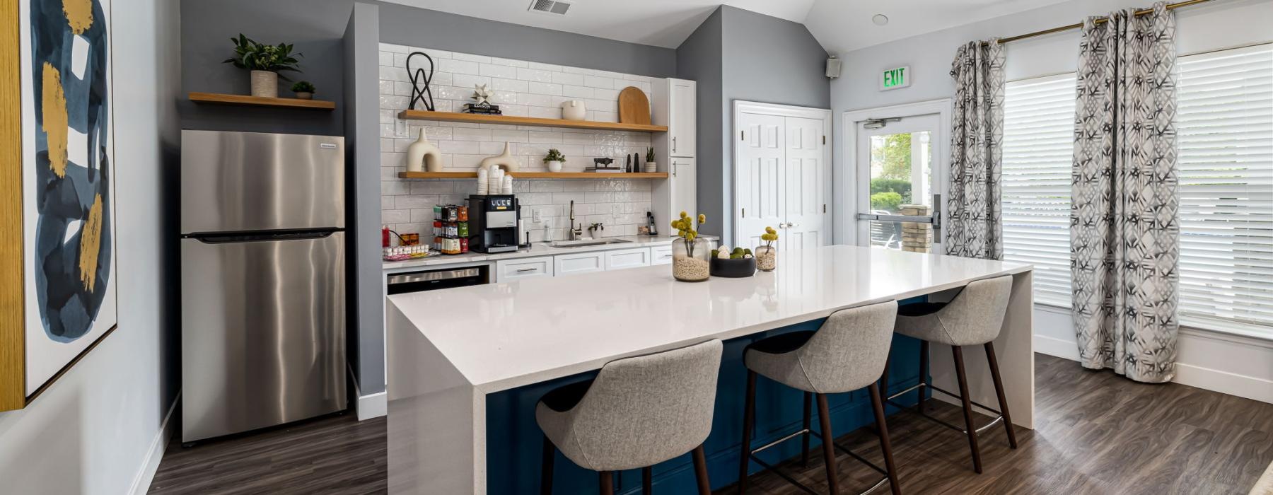 a kitchen with a bar and stools