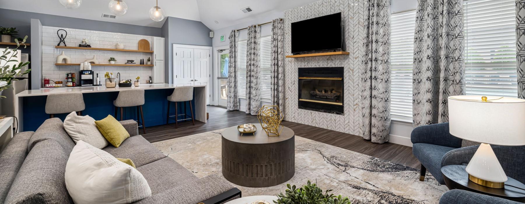 Living room with a fireplace at Fieldstone Apartment Homes luxury apartments in Mebane, NC