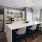 a kitchen with a bar and stools