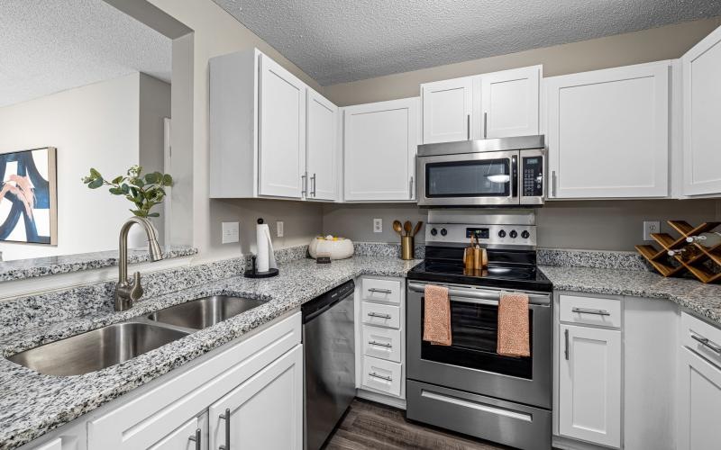 a kitchen with white cabinets