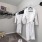 a white robe in a walk-in closet