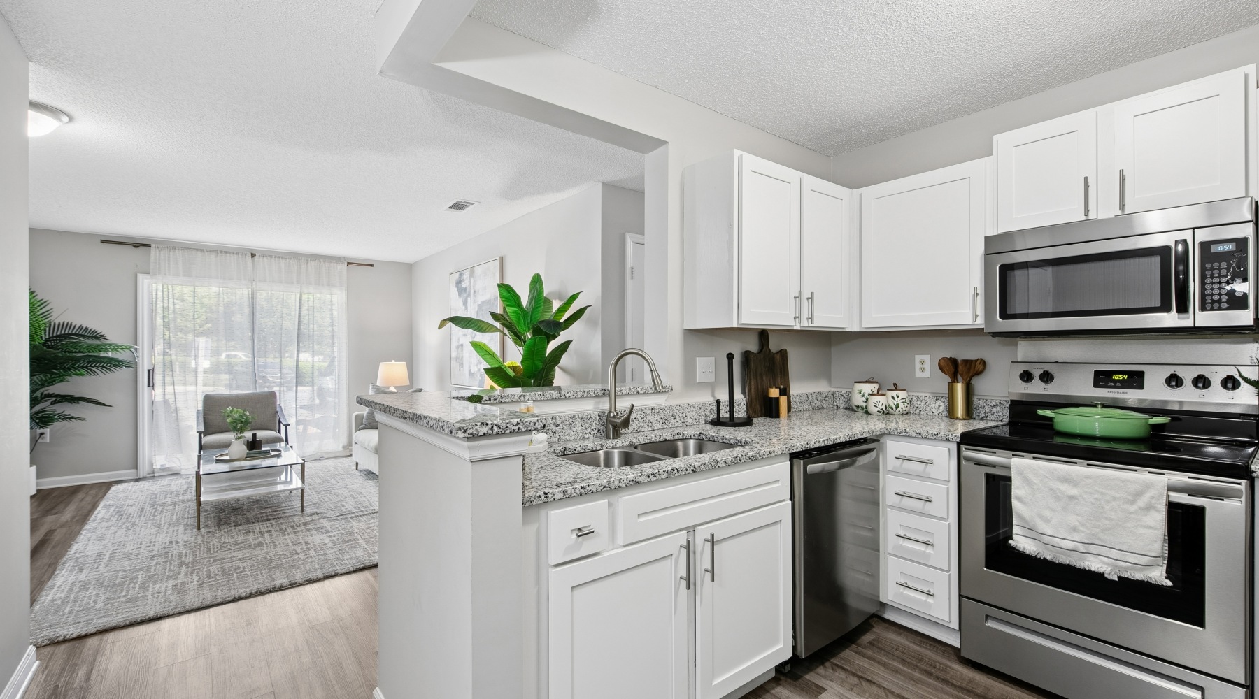a kitchen with white cabinets