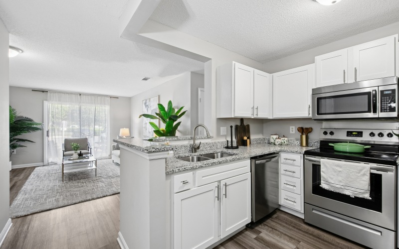 A Kitchen With White Cabinets
