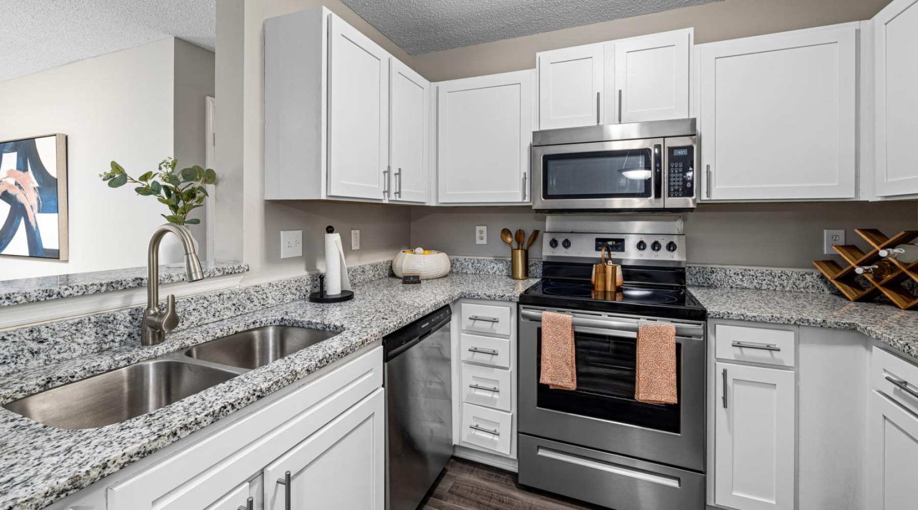 a kitchen with white cabinets