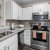 a kitchen with white cabinets